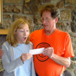 Image: Steve Johnson, Rendezvous coordinator, presents Cynthia Martin with the 2011 Rendezvous donation.
